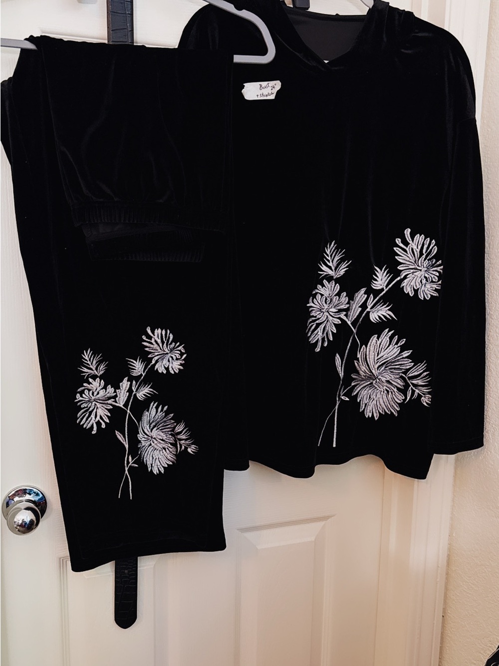 Black Velvet Two-Piece Set with White Floral Embroidery top is hooded